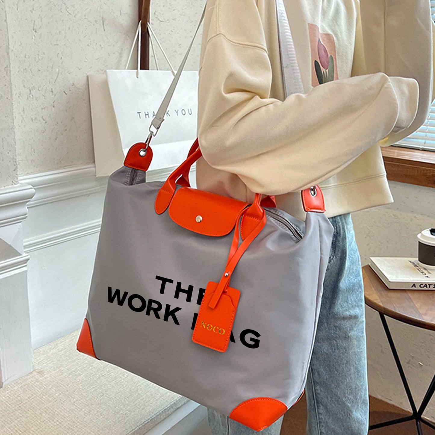 La "bolsa de trabajo" con asas dobles y correa ajustable 